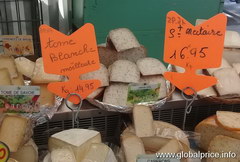 Prices for grocery items in Paris on the market, Various cheeses at the market